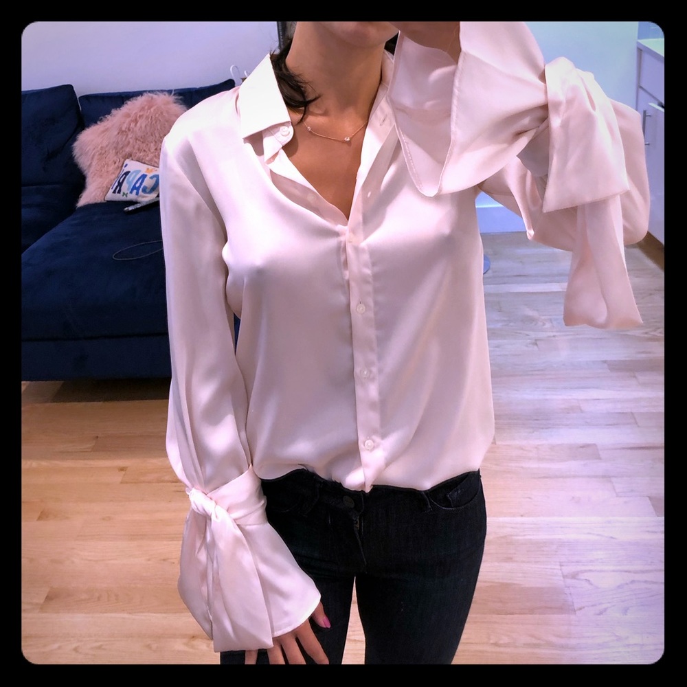 Pale pink silky blouse with bow sleeves